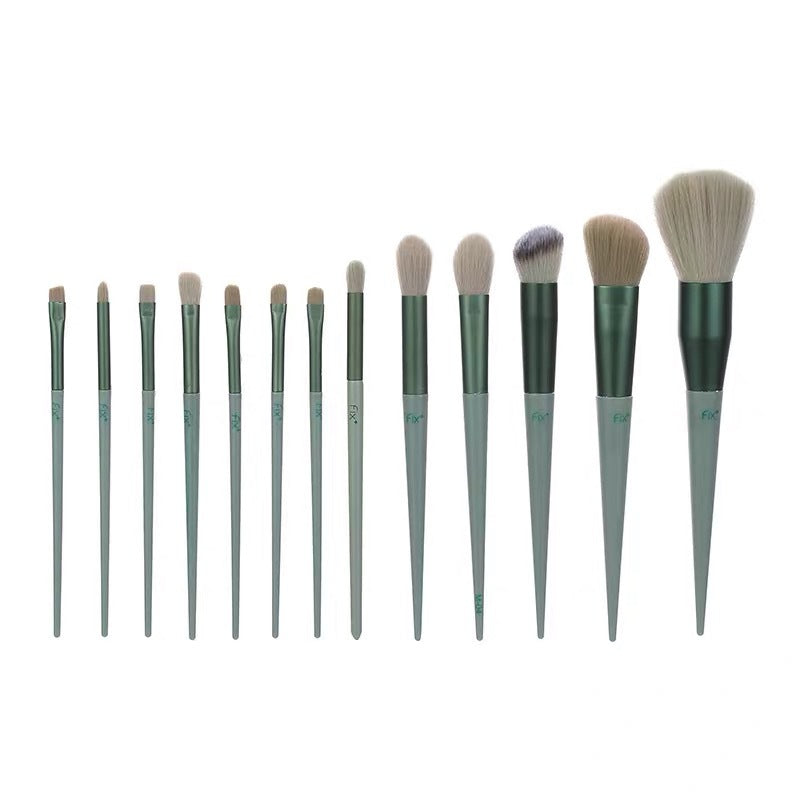 All 13 makeup brushes lined up side by side showing various sizes from face to eye brushes