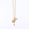 Gold necklace with a dandelion pendant on a white background