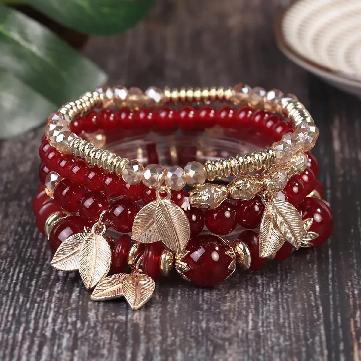 Wine red bohemian beaded stack bracelet set with gold leaf charms