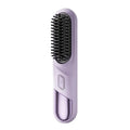 A lavender purple electric hairbrush with black bristles, shown vertically on a plain white background.