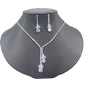 A silver-tone jewelry set featuring a V-necklace and matching drop earrings, displayed on a dark gray mannequin bust against a white background.