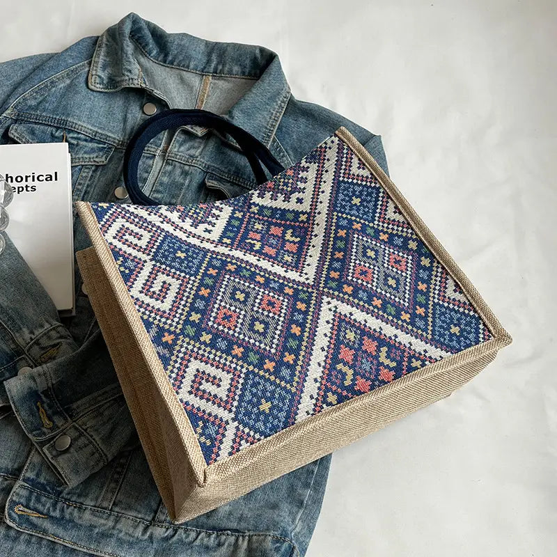 Embroidered box with geometric pattern on denim fabric