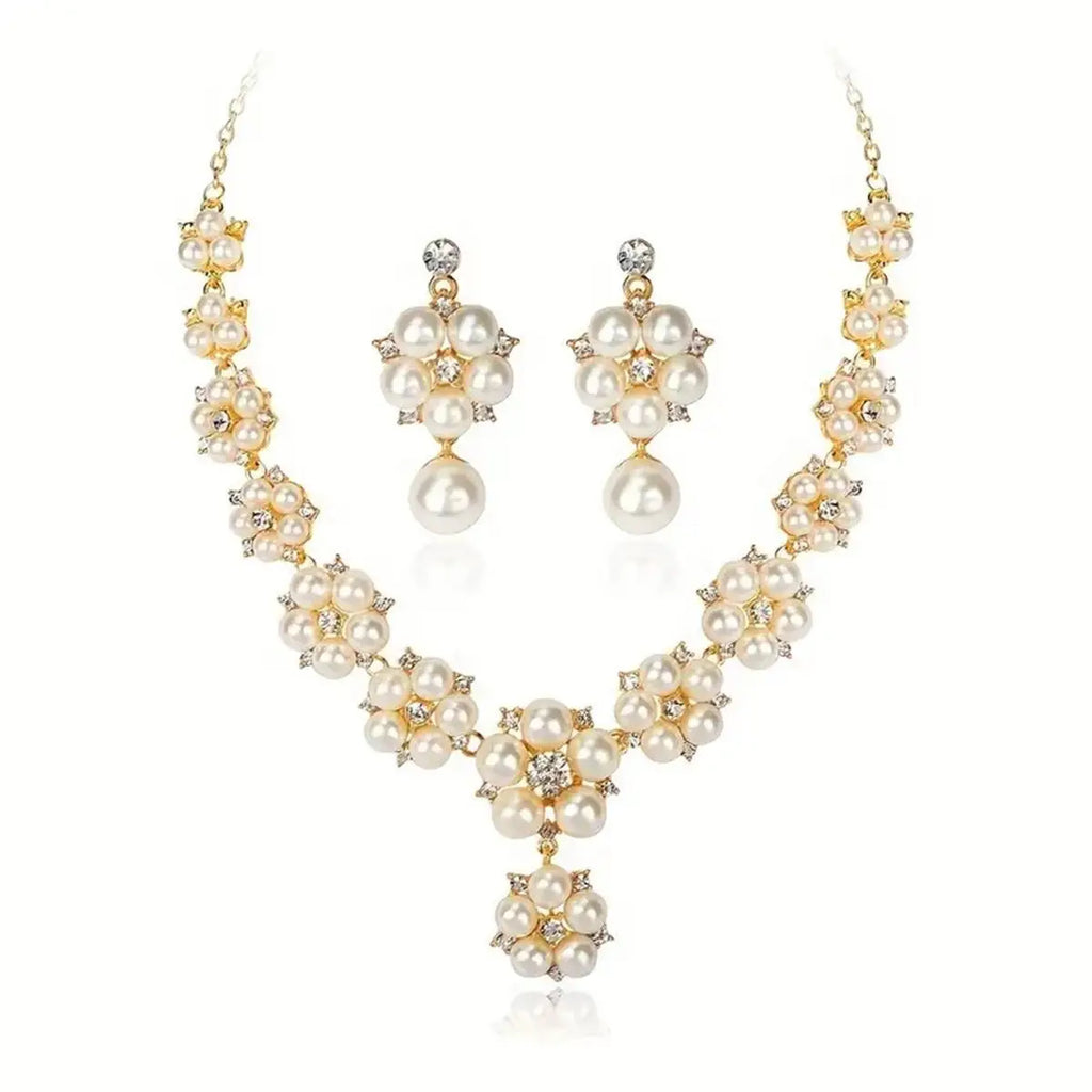 Gold-plated pearl jewelry set featuring a choker necklace and matching drop earrings, decorated with faux pearls and clear rhinestones on a white background.