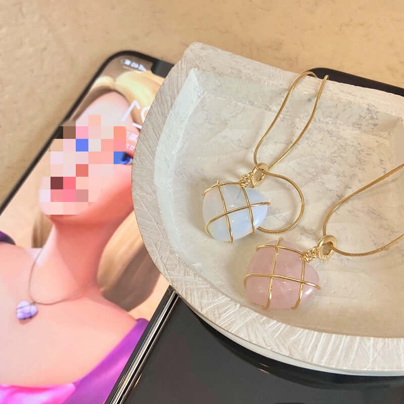 Gold earrings with gemstones in a jewelry box