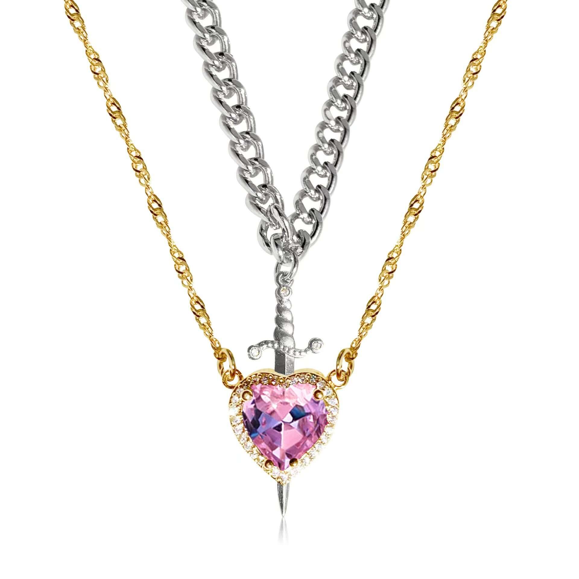 Necklace with a pink heart-shaped pendant and sword charm on a white background