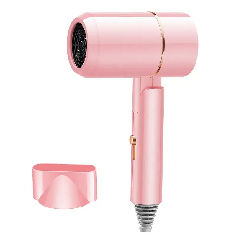 Pink handheld hair dryer with nozzle attachment on a white background