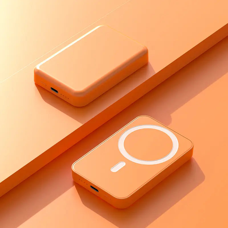 Two orange power banks on an orange surface