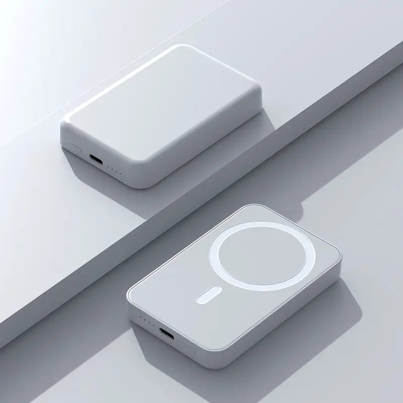 Two white rectangular devices on a light gray surface