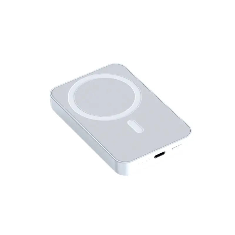 White wireless charging pad on a white background