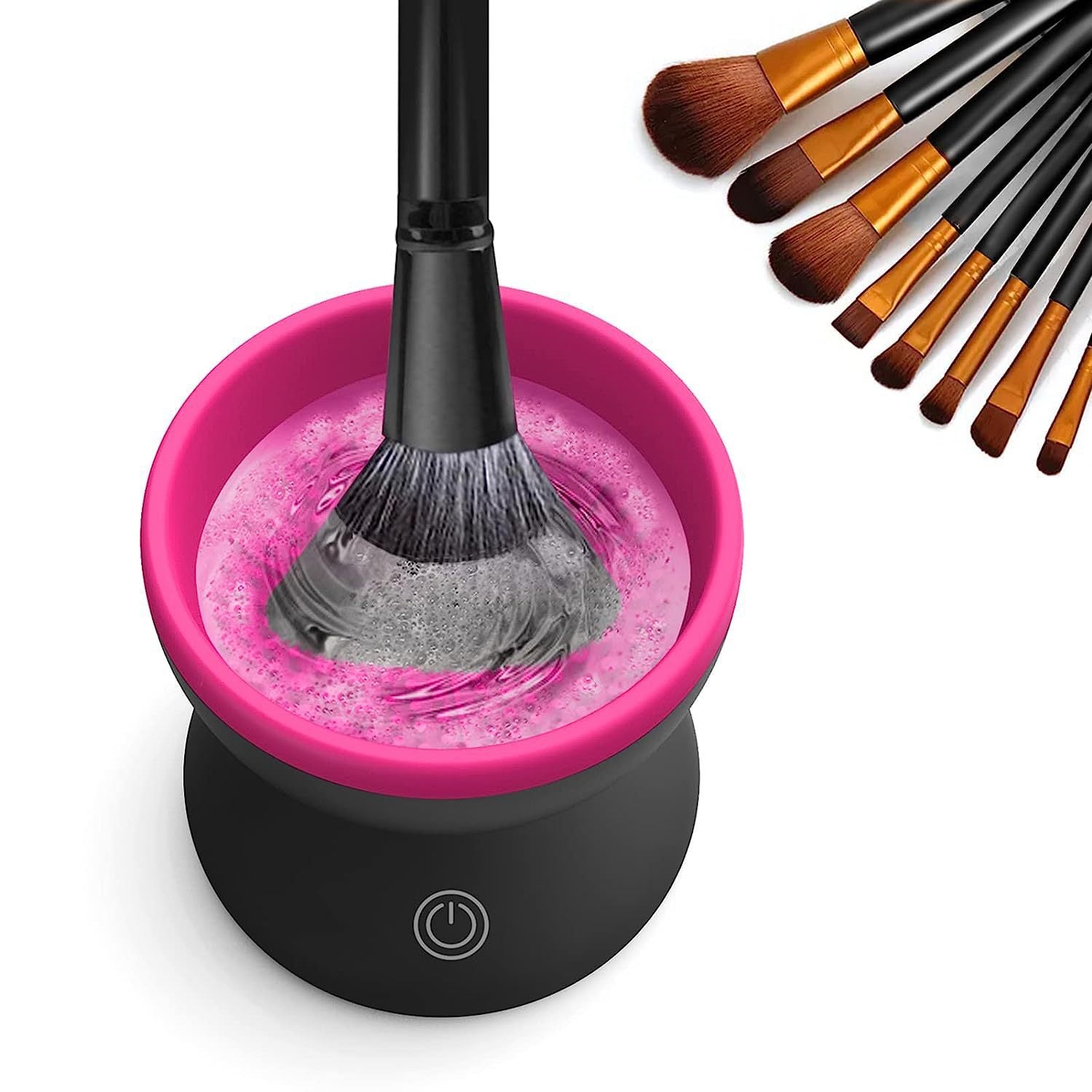 Black electric makeup brush cleaner unit with bright pink LED light during operation with brushes.