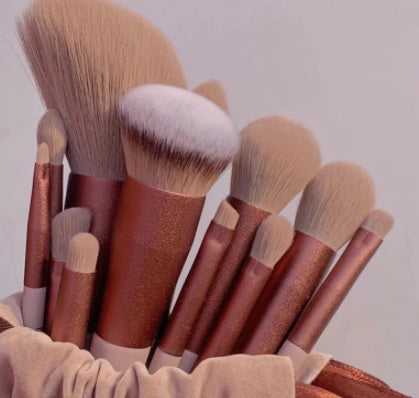 Close up view of plush powder and foundation makeup brush heads.