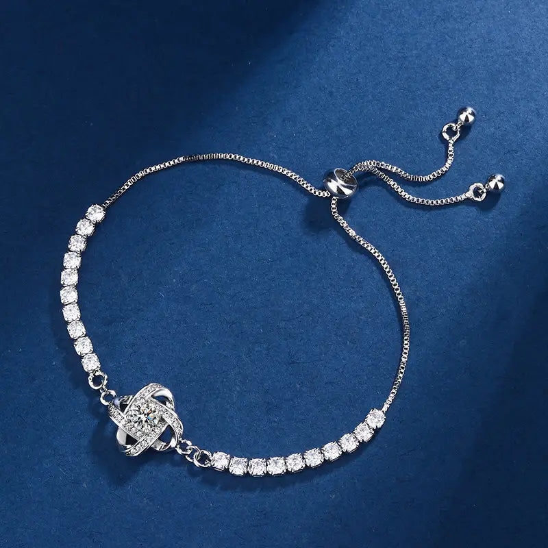 Women silver bolo bracelet featuring graduated round sparkling crystals