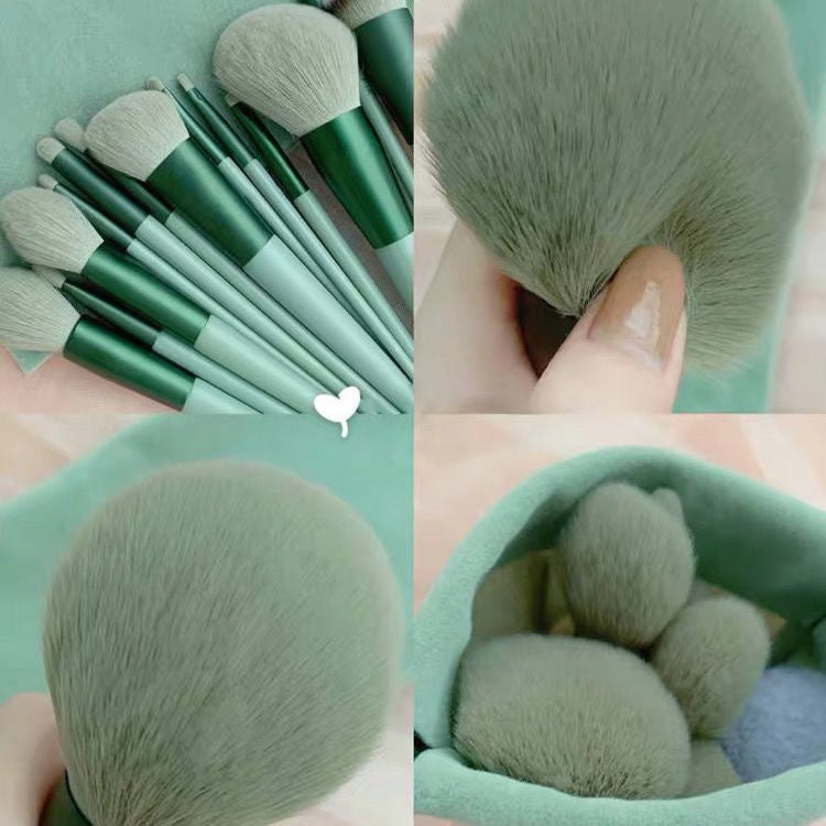 13 piece makeup brush set with dark bristles and handles.