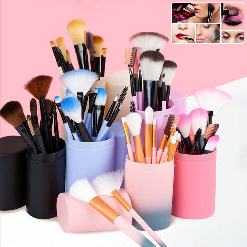 Assorted colorful makeup brush sets displayed standing in blue, pink, and black cylindrical storage holders against a pink background.