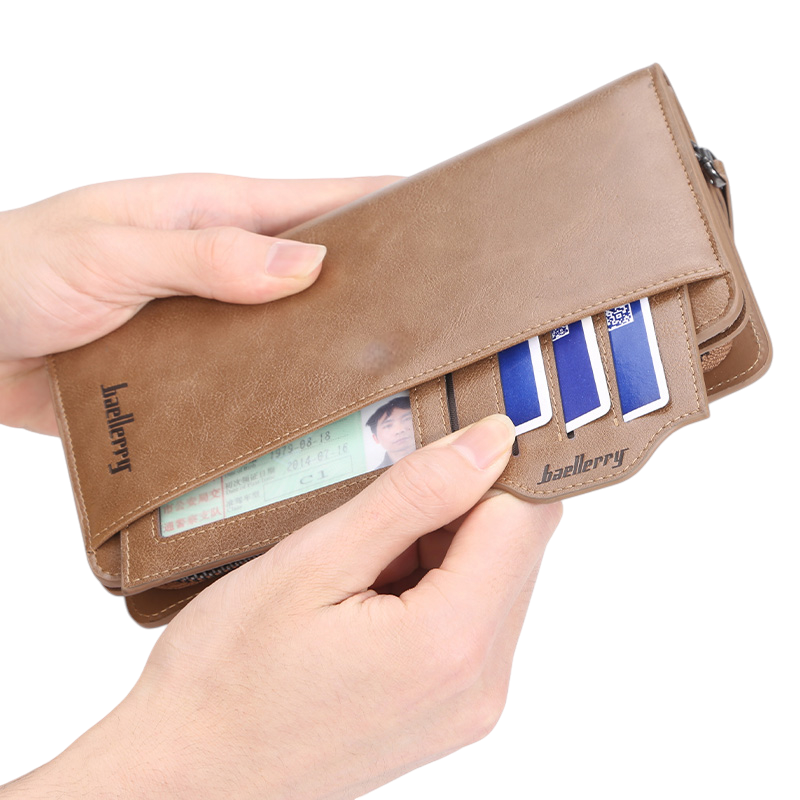 Open brown leather long wallet showing card slots held by hands