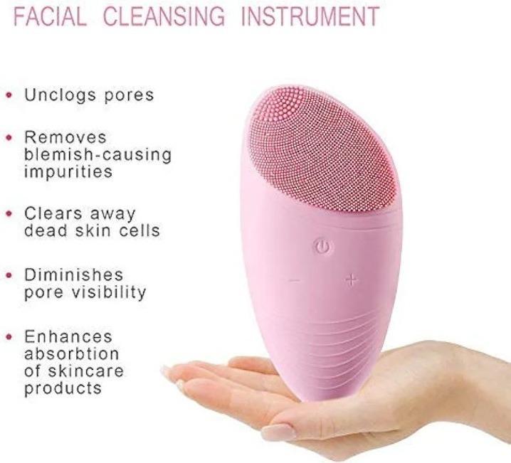 Pink silicone face massager resting in a hand with product benefits listed on the background.