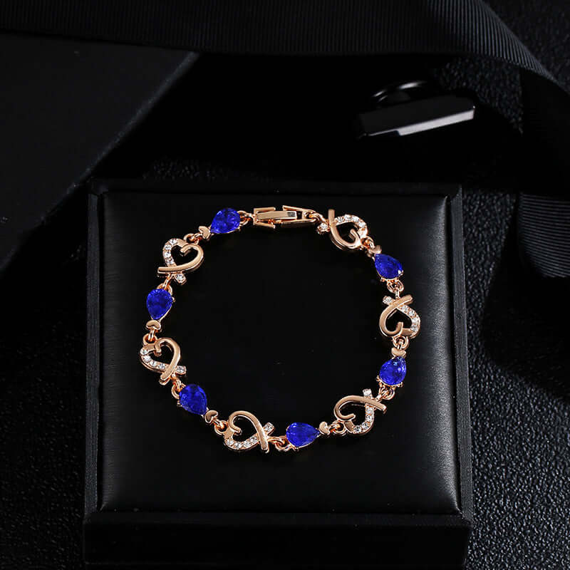 Jewelry bracelet with blue stones on a black box