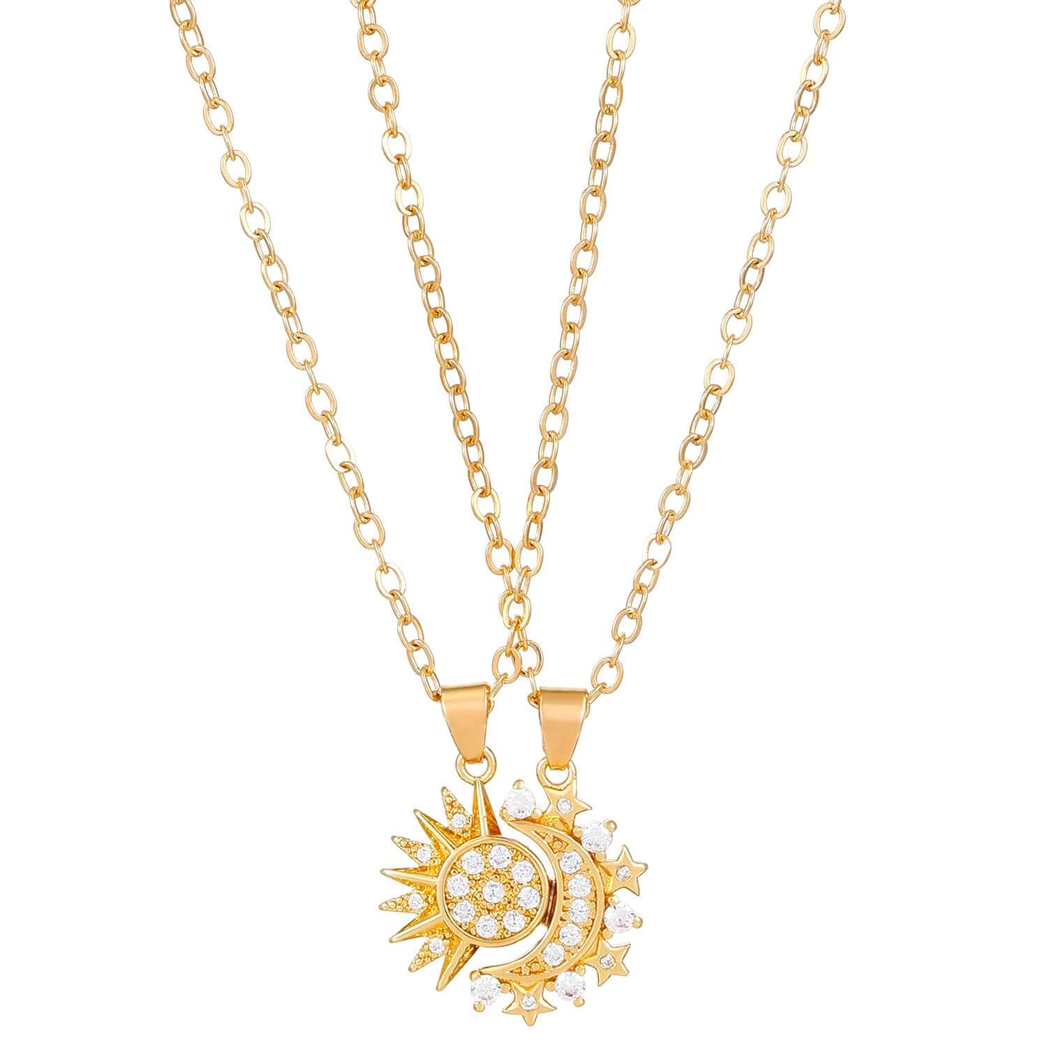  Person holding a silver and crystal sun and moon charm necklace on delicate chain.