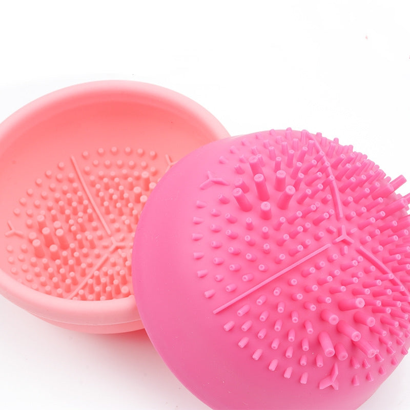 Close-up of pink textured silicone cleaning pads used inside the automatic brush washer.